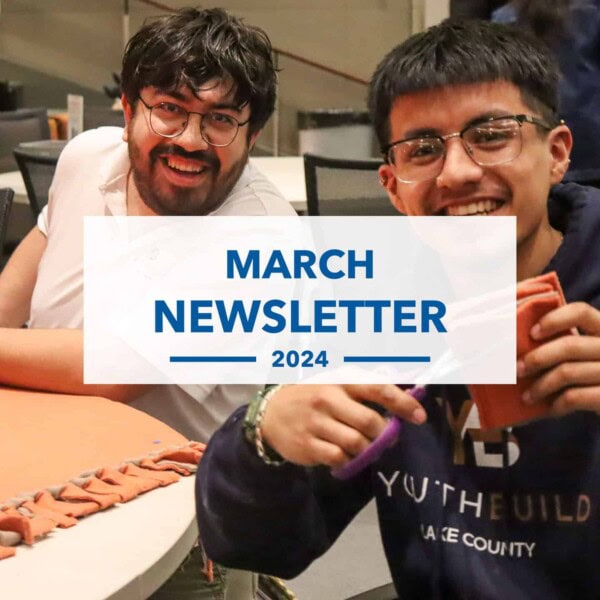 Two young men smiling at a table while crafting with orange felt. A white overlay in the center reads, March Newsletter 2024 in blue text.